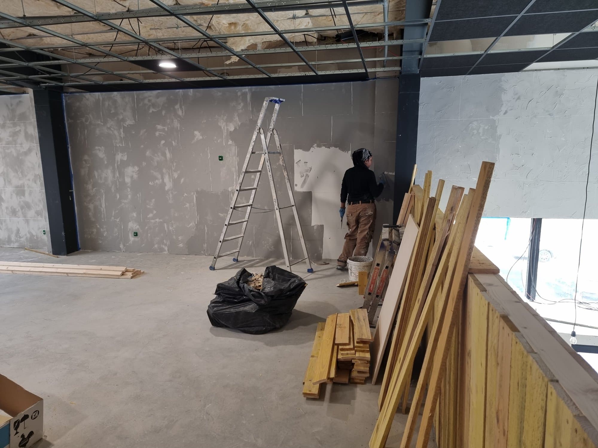The floor plate being painted, set timber waiting