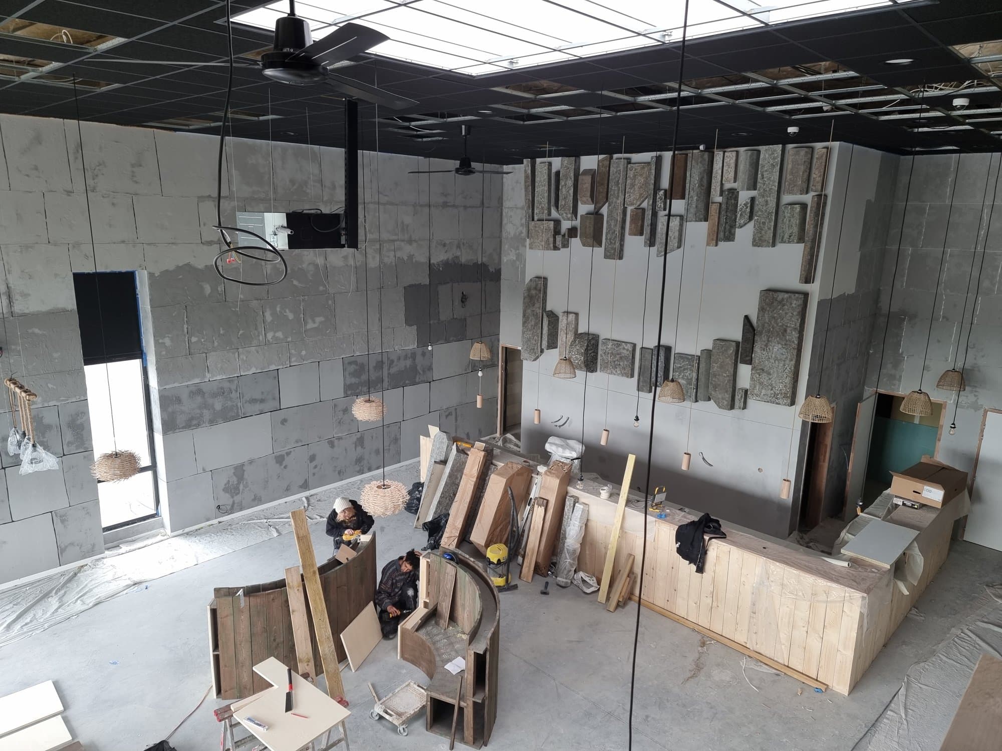 The bare floor plate and the bar frame going up