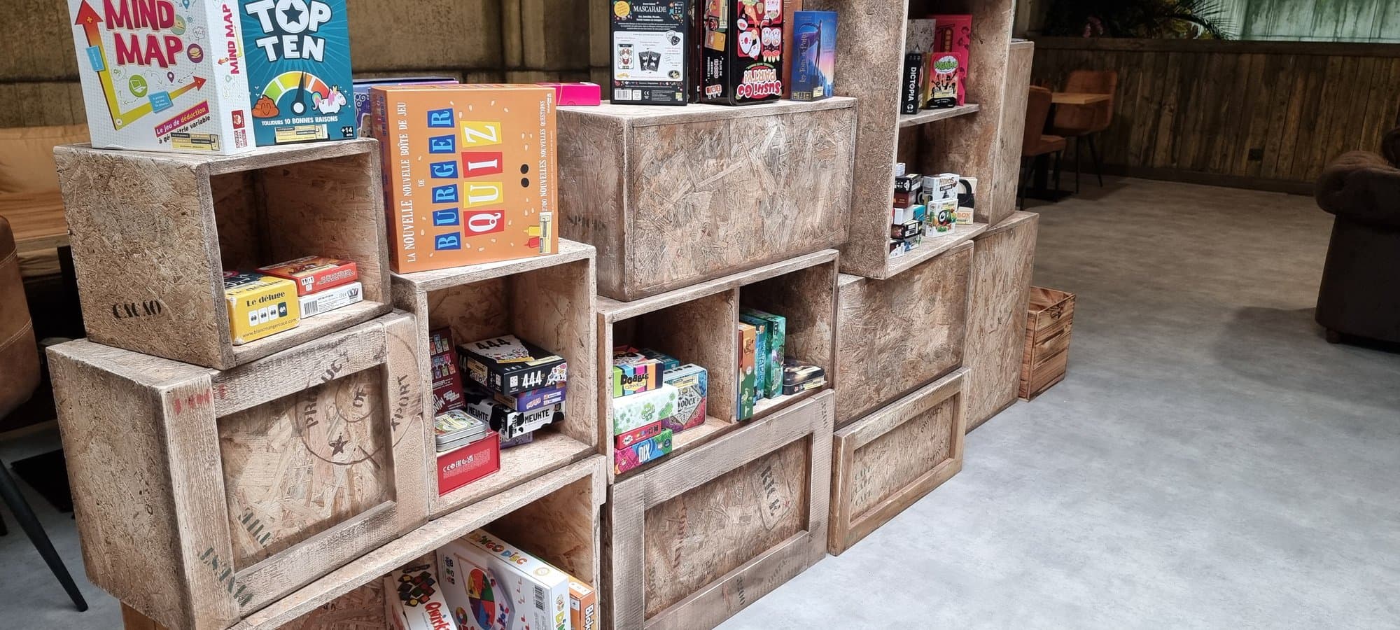 Board games shelved in crates within the decoration