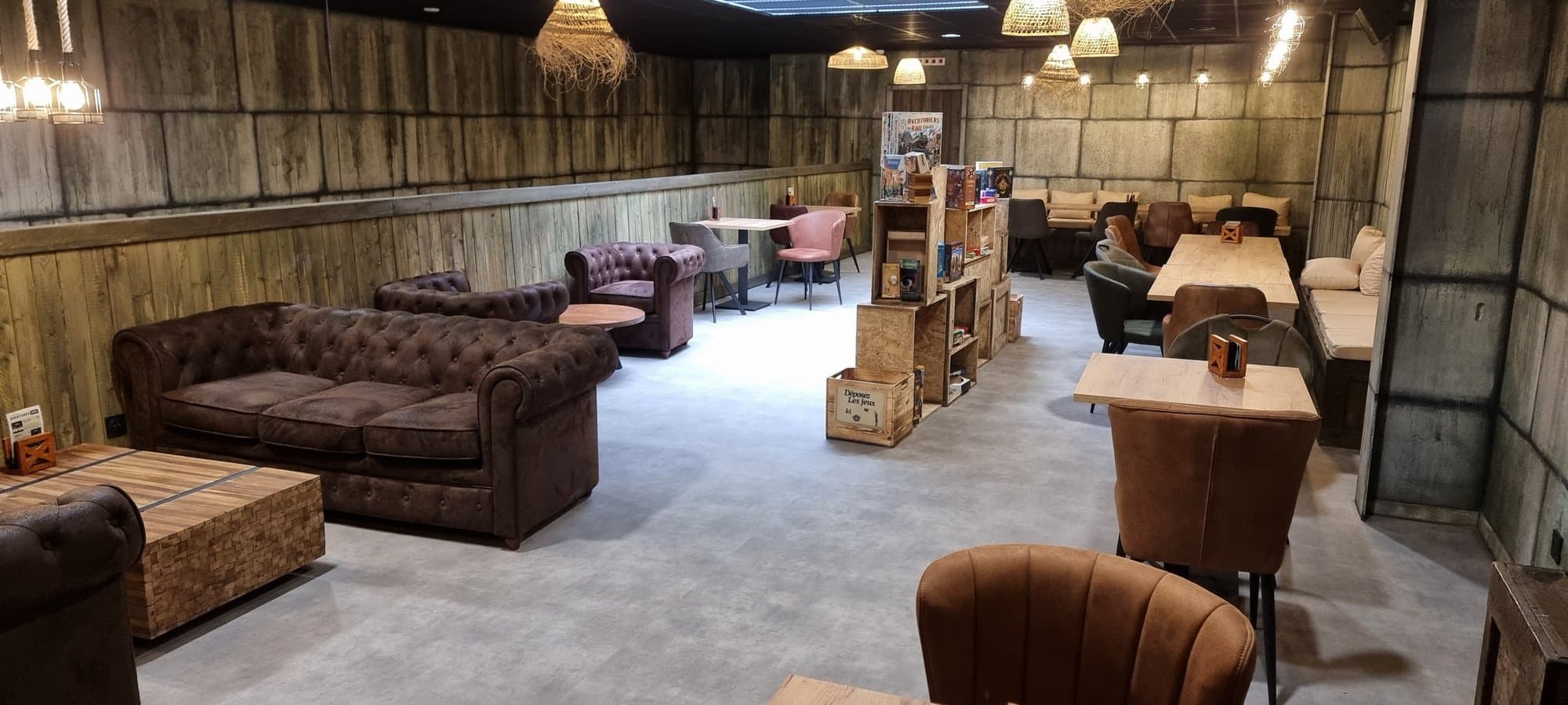The games bar lounge, sofas and crates of board games
